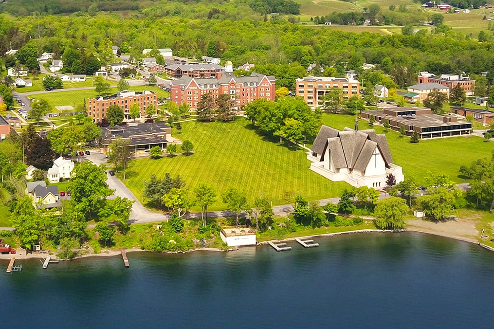 An aerial view of Keuka College's campus, showing a number of buildings and the lake
