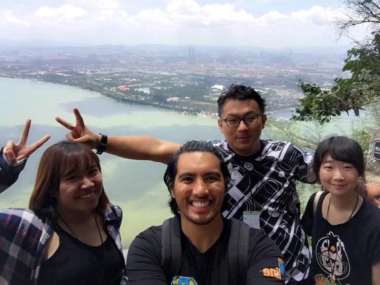 A Keuka College student takes a selfie with three students at Yunan University.