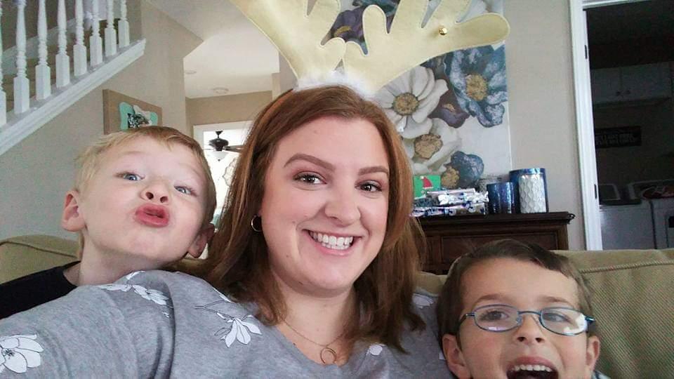 Alyssa takes a selfie with her two toddler newphews.