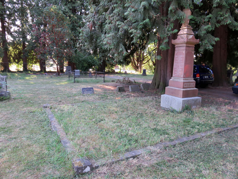 James Wilbur and William Roberts burial plot, Lee Mission Cemetery, Salem, Oregon.  The portion in the foreground belongs to the Wilburs, and the likely Ann Wilbur burial site is in the left center, just inside the low cement wall. 
